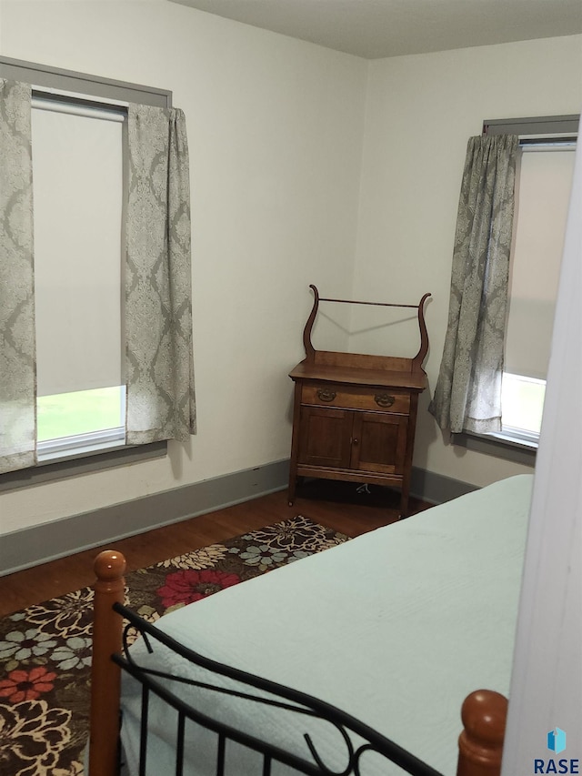 787 70th Ave, Beaver Creek, MN 56116 - bedroom featuring dark wood-style flooring and baseboards