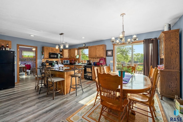 48484 262nd St, Valley Springs, SD 57068 - dining room featuring a chandelier, light wood-style flooring, and recessed lighting