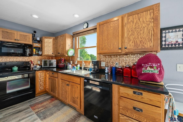 48484 262nd St, Valley Springs, SD 57068 - kitchen featuring black appliances, a sink, tasteful backsplash, brown cabinetry, and recessed lighting