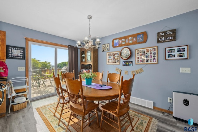 48484 262nd St, Valley Springs, SD 57068 - dining room featuring a chandelier, light wood-type flooring, and baseboards