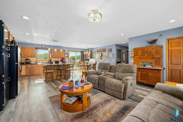 48484 262nd St, Valley Springs, SD 57068 - living area with light wood-style flooring, recessed lighting, and a chandelier