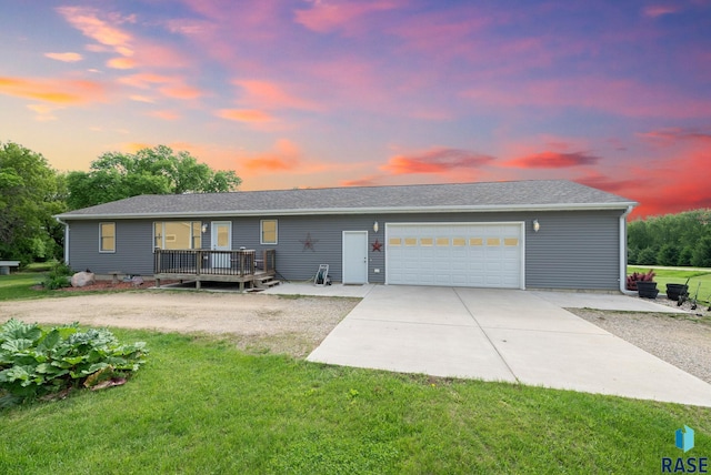 48484 262nd St, Valley Springs, SD 57068 - view of front facade featuring a front lawn, driveway, an attached garage, and a deck