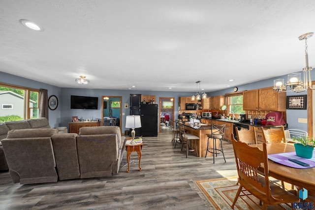 48484 262nd St, Valley Springs, SD 57068 - living area with a chandelier, recessed lighting, and dark wood-type flooring