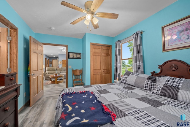 48484 262nd St, Valley Springs, SD 57068 - bedroom with a closet, light wood-style floors, a ceiling fan, and baseboards