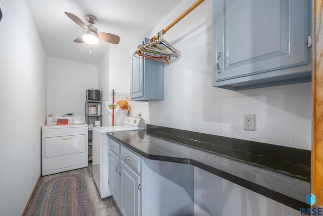 48484 262nd St, Valley Springs, SD 57068 - kitchen featuring dark countertops, separate washer and dryer, a ceiling fan, and wood finished floors