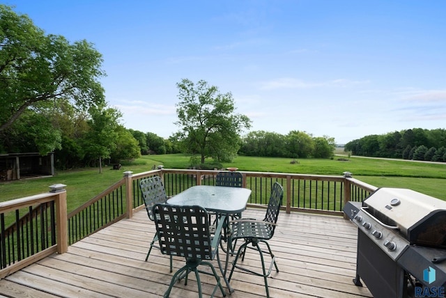 48484 262nd St, Valley Springs, SD 57068 - deck featuring grilling area, outdoor dining space, and a lawn