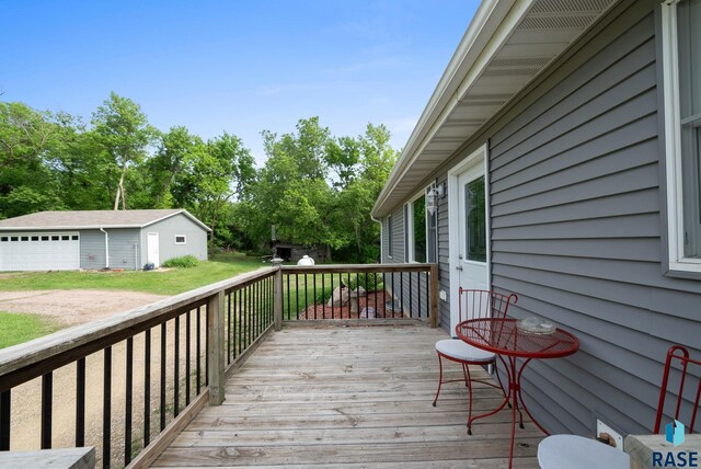 48484 262nd St, Valley Springs, SD 57068 - wooden deck with an outdoor structure and a detached garage