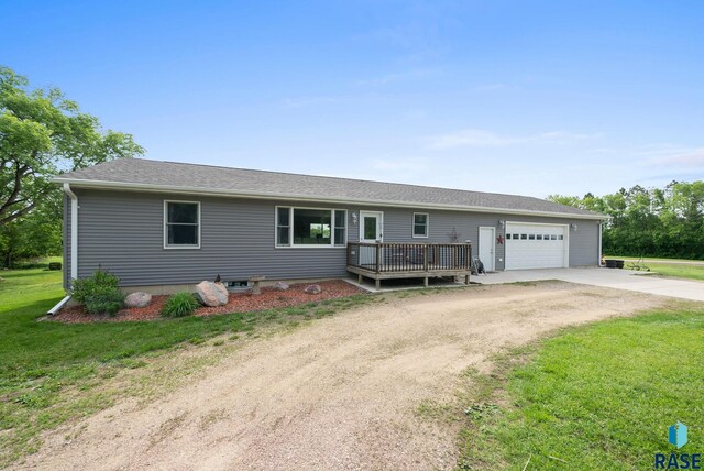48484 262nd St, Valley Springs, SD 57068 - ranch-style home with concrete driveway, a garage, a front yard, and a deck