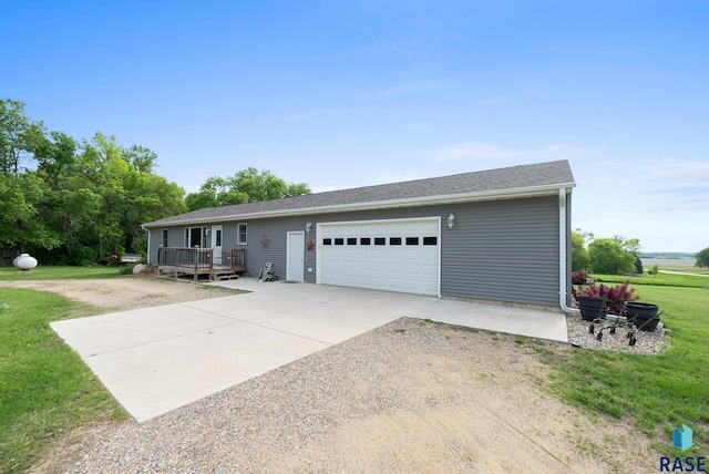 48484 262nd St, Valley Springs, SD 57068 - single story home with concrete driveway, a front lawn, an attached garage, and a wooden deck