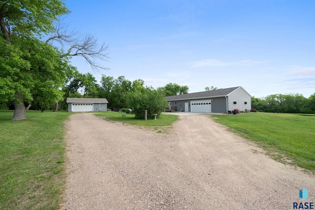 48484 262nd St, Valley Springs, SD 57068 - single story home with dirt driveway, a detached garage, and a front yard
