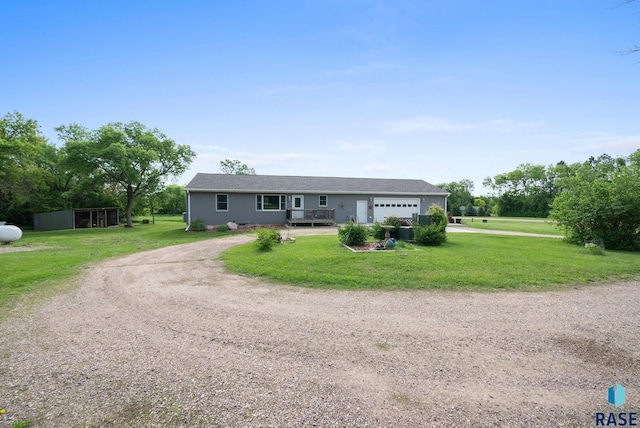 48484 262nd St, Valley Springs, SD 57068 - ranch-style house featuring driveway, a garage, and a front lawn