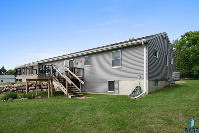 48484 262nd St, Valley Springs, SD 57068 - rear view of property featuring cooling unit, a yard, a wooden deck, and stairs