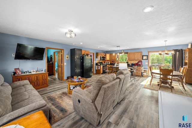 48484 262nd St, Valley Springs, SD 57068 - living area featuring wood finished floors, a chandelier, and recessed lighting