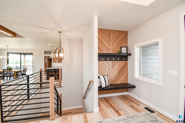 6504 E Hawker Trl, Sioux Falls, SD 57110 - stairway with a chandelier, wood finished floors, baseboards, and recessed lighting