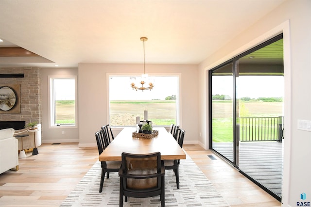6504 E Hawker Trl, Sioux Falls, SD 57110 - dining area with light wood-style flooring, a chandelier, baseboards, and recessed lighting