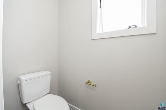6504 E Hawker Trl, Sioux Falls, SD 57110 - bathroom with toilet and baseboards