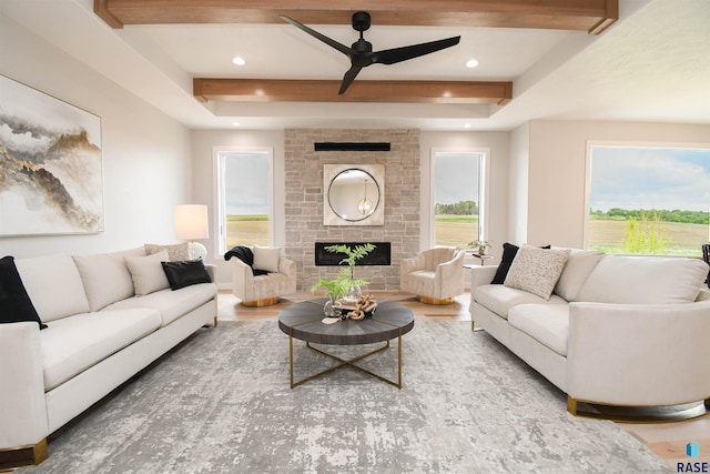 6504 E Hawker Trl, Sioux Falls, SD 57110 - living room featuring a ceiling fan, a stone fireplace, beam ceiling, wood finished floors, and recessed lighting