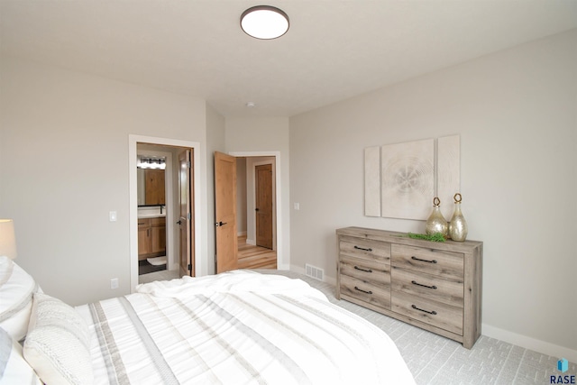 6504 E Hawker Trl, Sioux Falls, SD 57110 - bedroom with baseboards and ensuite bath