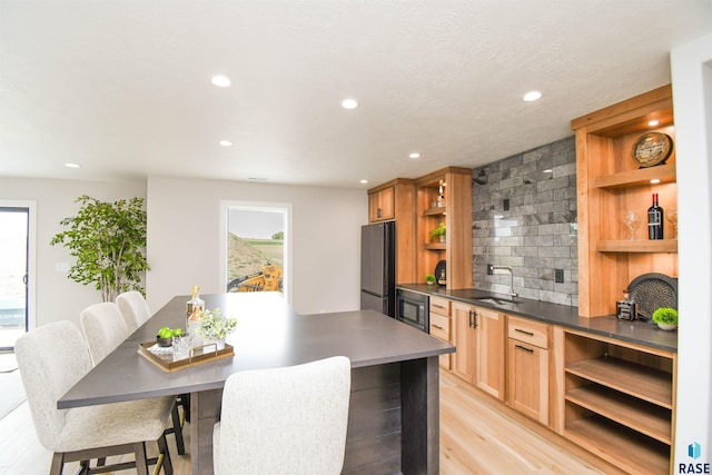 6504 E Hawker Trl, Sioux Falls, SD 57110 - kitchen featuring open shelves, freestanding refrigerator, a sink, plenty of natural light, and recessed lighting
