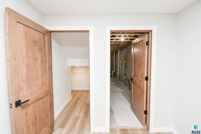 6504 E Hawker Trl, Sioux Falls, SD 57110 - hall featuring light wood finished floors and baseboards