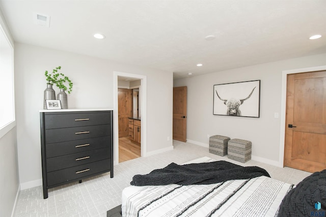 6504 E Hawker Trl, Sioux Falls, SD 57110 - bedroom with recessed lighting, baseboards, light colored carpet, and connected bathroom