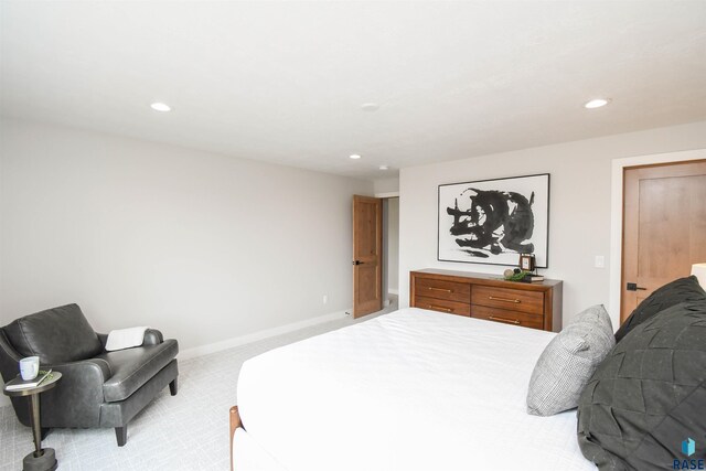 6504 E Hawker Trl, Sioux Falls, SD 57110 - bedroom with light colored carpet, recessed lighting, and baseboards