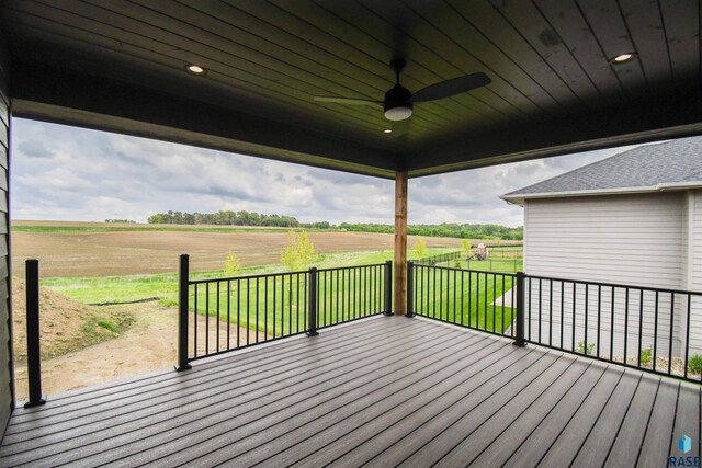 6504 E Hawker Trl, Sioux Falls, SD 57110 - wooden terrace with a ceiling fan, a view of countryside, and a yard