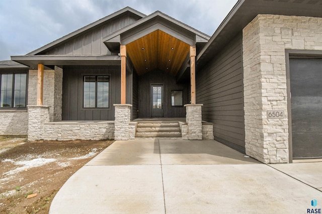 6504 E Hawker Trl, Sioux Falls, SD 57110 - entrance to property featuring board and batten siding and stone siding