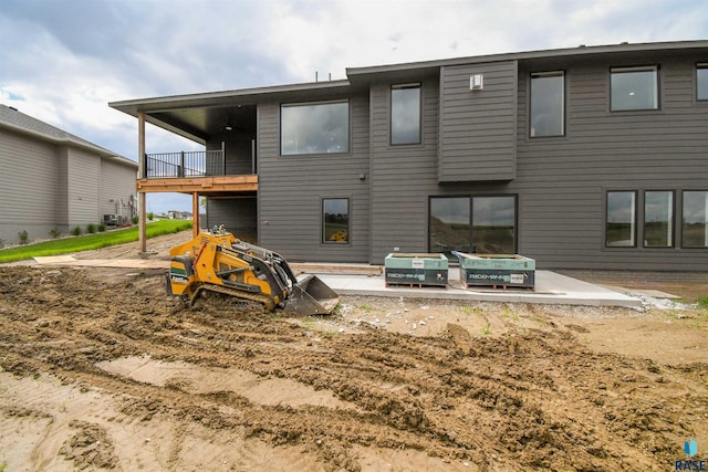 6504 E Hawker Trl, Sioux Falls, SD 57110 - rear view of property with a balcony and a patio area