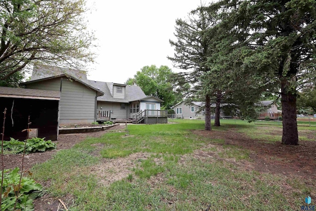 6905 W 6th St, Sioux Falls, SD 57107 - view of green lawn featuring a deck