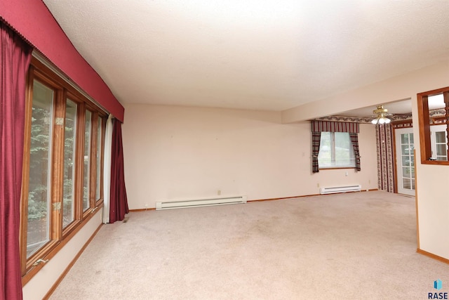 6905 W 6th St, Sioux Falls, SD 57107 - unfurnished room with baseboard heating, light carpet, and baseboards