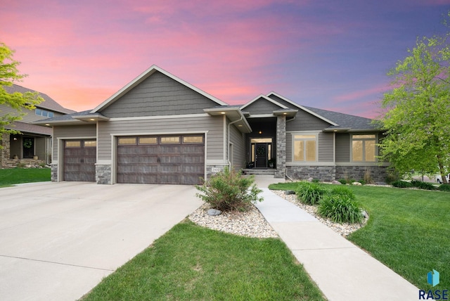 2900 W Stratton St, Sioux Falls, SD 57108 - craftsman inspired home featuring stone siding, a garage, concrete driveway, and a front yard