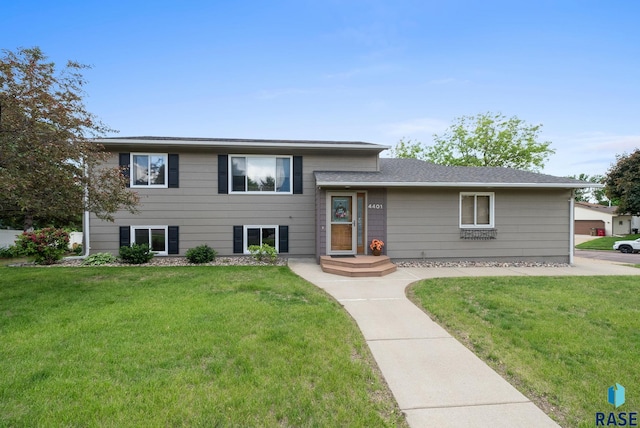 4401 E 28th St, Sioux Falls, SD 57103 - tri-level home featuring a front lawn and roof with shingles