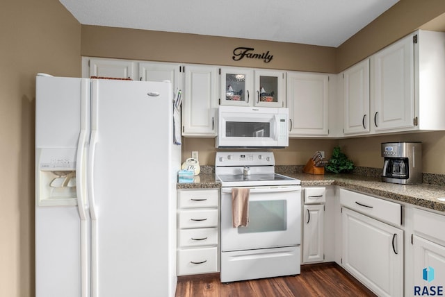 4401 E 28th St, Sioux Falls, SD 57103 - kitchen with white appliances, white cabinets, dark wood-type flooring, and glass insert cabinets