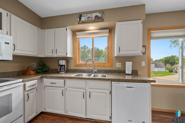 4401 E 28th St, Sioux Falls, SD 57103 - kitchen with white appliances, a sink, white cabinetry, and dark wood-style flooring