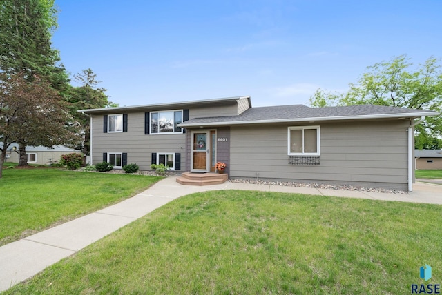 4401 E 28th St, Sioux Falls, SD 57103 - split level home featuring a front lawn