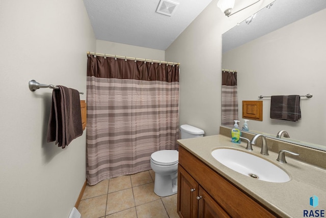 4401 E 28th St, Sioux Falls, SD 57103 - bathroom with toilet, vanity, tile patterned floors, and curtained shower