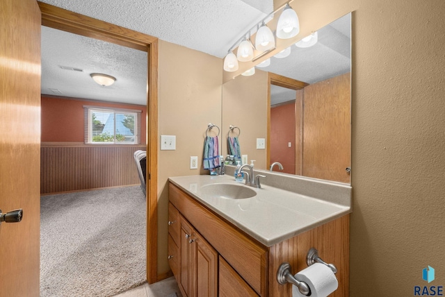 4401 E 28th St, Sioux Falls, SD 57103 - bathroom with a textured ceiling and vanity