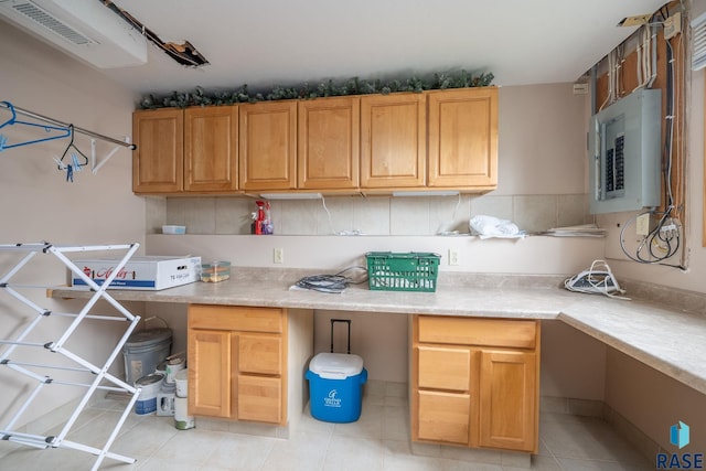 4401 E 28th St, Sioux Falls, SD 57103 - kitchen featuring electric panel, light countertops, and light tile patterned floors