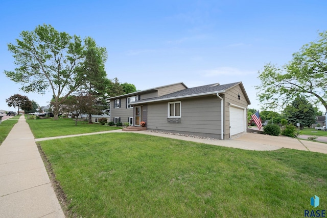 4401 E 28th St, Sioux Falls, SD 57103 - view of front of home with a front lawn, driveway, and an attached garage