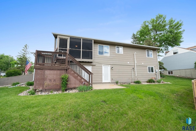 4401 E 28th St, Sioux Falls, SD 57103 - back of property with stairs, a yard, and a sunroom