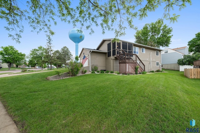 4401 E 28th St, Sioux Falls, SD 57103 - view of side of property featuring stairs and a sunroom