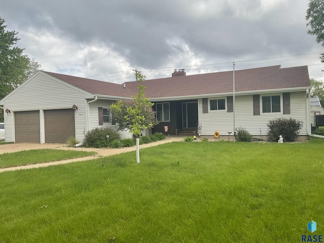 501 E 4th St, Parker, SD 57053 - ranch-style home featuring a garage, a front lawn, driveway, a chimney, and entry steps