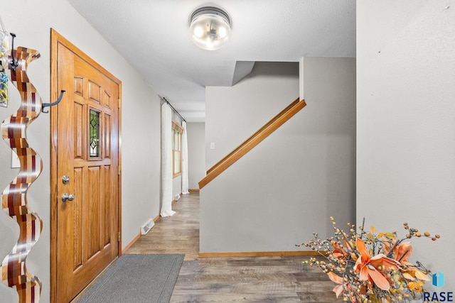4804 W 39th St, Sioux Falls, SD 57106 - entrance foyer with wood finished floors, stairs, and baseboards