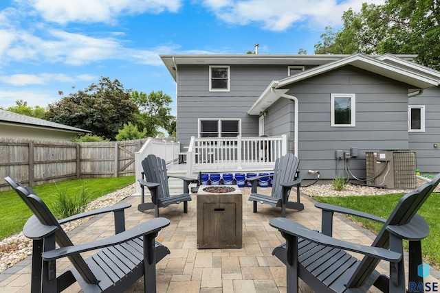 4804 W 39th St, Sioux Falls, SD 57106 - back of house with an outdoor fire pit, a patio area, central AC unit, a fenced backyard, and a wooden deck