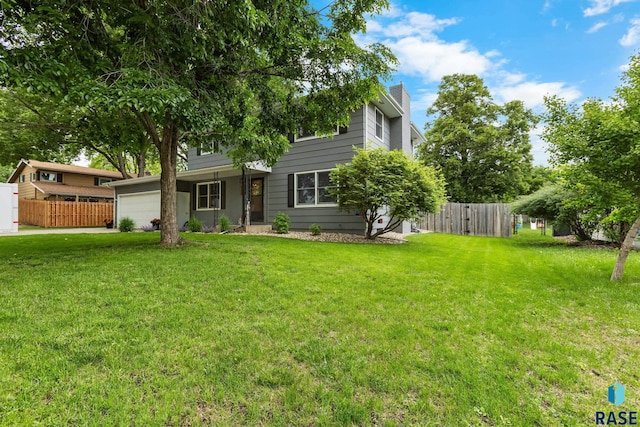 4804 W 39th St, Sioux Falls, SD 57106 - view of front facade featuring an attached garage and a chimney