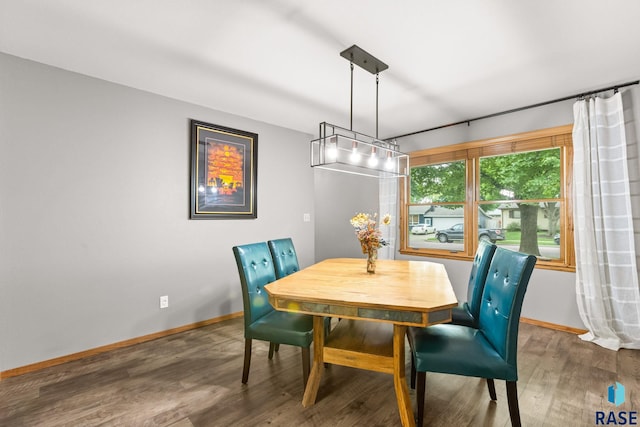 4804 W 39th St, Sioux Falls, SD 57106 - dining room featuring baseboards and wood finished floors