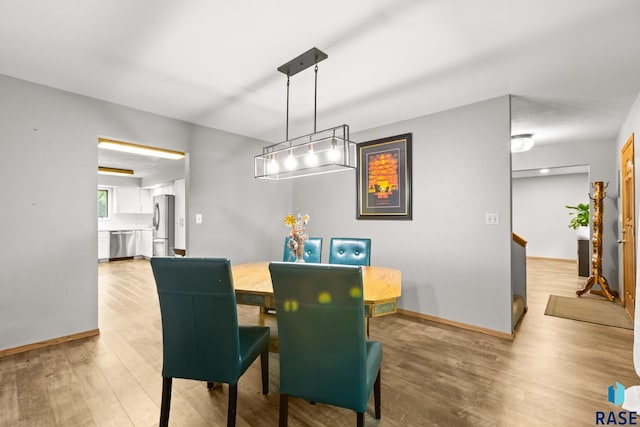 4804 W 39th St, Sioux Falls, SD 57106 - dining area with wood finished floors and baseboards