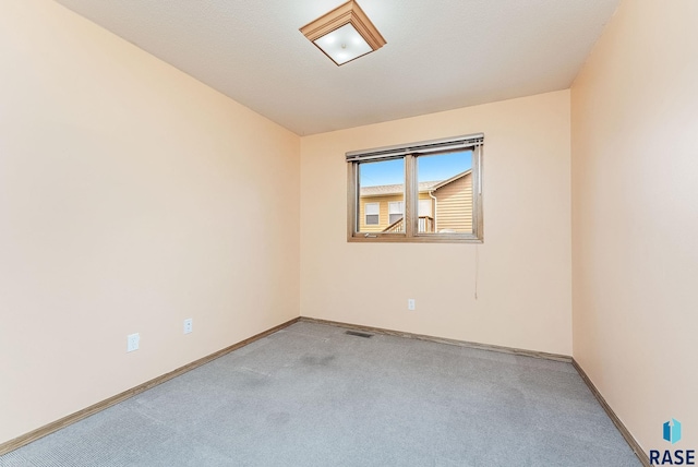 201 N Foss Ave, Sioux Falls, SD 57110 - carpeted spare room featuring baseboards