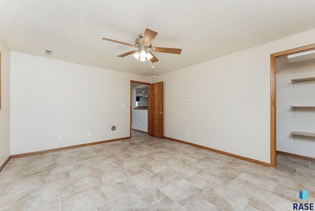201 N Foss Ave, Sioux Falls, SD 57110 - spare room featuring a ceiling fan, baseboards, and stone finish floors